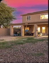 Queen Creek backyard before renovation, with torn-up grass and pool fencing